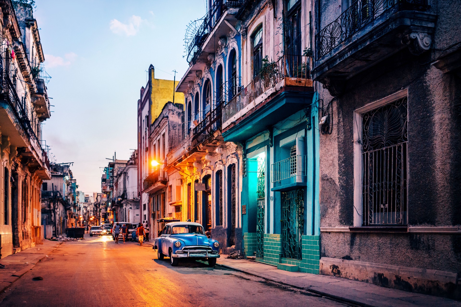 Old American car on street at dusk, Havana, Cuba